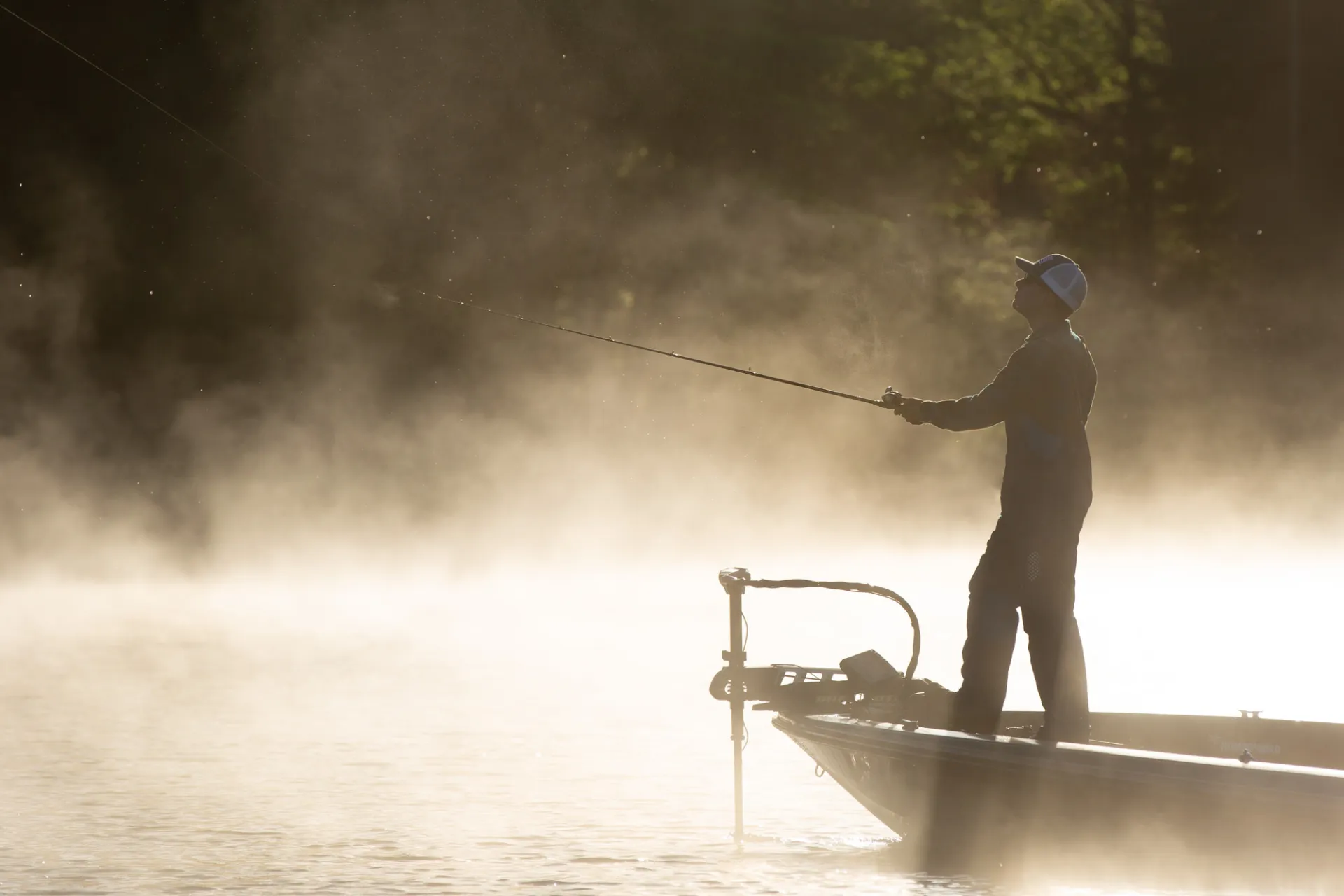 A person fishing in the morning